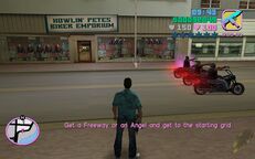 Tommy Vercetti about to get on to a motorcycle outside The Greasy Chopper.