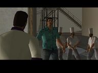 Lance Vance passes Tommy Vercetti a gun as they are confronted by three chefs.