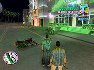 Tommy Vercetti shooting one of the security guards.