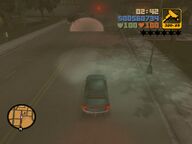 Claude, in the car, about to drive through a checkpoint.