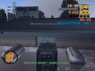 Claude parking the Trashmaster laiden with explosives at the back of the factory.