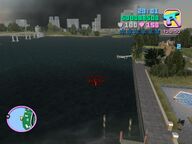 The bomb being dropped towards the boats below.