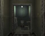 The first floor's bathroom at the end of the hallway.