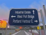 A street sign in GTA III depicting an alternate name of the bridge, "West Port Bridge". The name is whited-out in GTA Liberty City Stories.