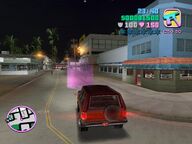 Tommy Vercetti arriving at Café Robina in a four-door vehicle.
