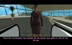 The woman standing on the balcony above the check-in desks.
