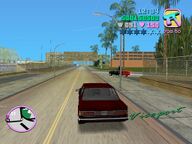 Tommy Vercetti being ambushed by a car in Viceport.