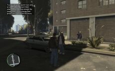 Niko confronting Jimmy (with instruction of "Stun Punch" showed at upper-left of screen).