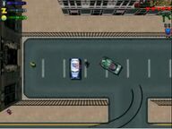 Claude Speed about to steal a police car.