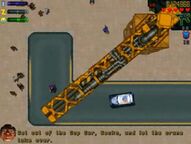 The police car about to be crushed by the car crusher