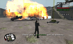 CJ destroys a portable by shooting a pair of explosive barrels.