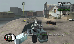 CJ smashes apart another portable with a bulldozer.