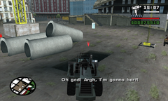 CJ pushes the foreman and the portable toilet into a pit.