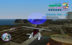 Tommy Vercetti about to fly through a blue corona above Little Haiti.