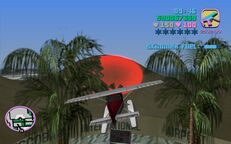 Tommy Vercetti about to fly through a red corona above Escobar International Airport.
