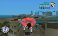 Tommy Vercetti about to fly through a red corona above Downtown.