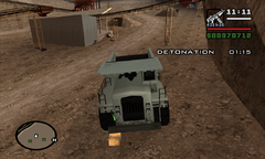 CJ smashes open a crate of dynamite.