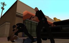 Eddie Pulaski holds Carl Johnson at gunpoint while Jimmy Hernandez handcuffs him as part of Tenpenny's staged arrest of him.