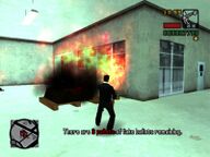 Toni Cipriani using the flamethrower in GTA Liberty City Stories.