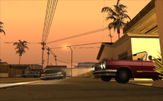 Cesar Vialpando pulls out of his garage with Kendl and head for the lowrider street race with Carl Johnson.
