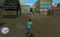 Tommy Vercetti shooting an armed woman.