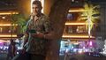 Jason is leaning at a tree with an IFruit Phone in his Hand
