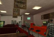 Interior of the normally inaccessible Jim's Sticky Ring interior in GTA San Andreas, complete with Rusty Brown's signage hung from the ceiling.