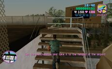 Tommy Vercetti about to go up a small stairway to the roof of Bakery & Cafeteria.
