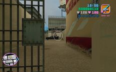 Tommy Vercetti shooting a man in black attire and his car.