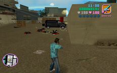 Tommy Vercetti shooting a red barrel.