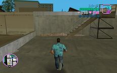 Tommy Vercetti about to go up a small stairway to get close to the Cherry Popper Ice Cream Factory.