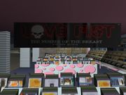 A Love Fist banner inside Vinyl Countdown in Grand Theft Auto: Vice City, advertising their newest album The Number of the Breast.