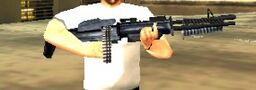 Toni Cipriani holding an M60.