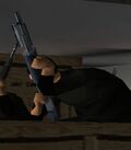 Closeup on the hitman with the M60.