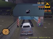 Claude driving Mike Forelli's car into 8-Balls garage.