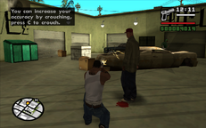 CJ shoots a bottle with his pistol.