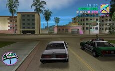 Tommy Vercetti driving Cam Jones back to his business in Viceport.