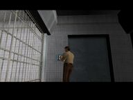 Tommy Vercetti releasing Cam Jones from his holding cell.