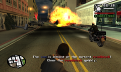 CJ destroys the final roadblock with grenades.