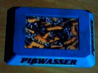An ashtray bearing the Pißwasser wordmark.