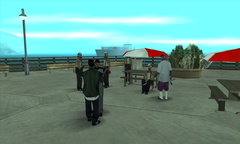 T-Bone Mendez and Ryder meet at the end of Pier 69, with guards from the San Fierro Rifa and Ballas.