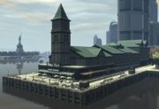 The unnamed Castle Gardens pier based on City Pier A as viewed to the northwest in GTA IV, with the Poop Deck seafood restaurant prominently depicted in the foreground.