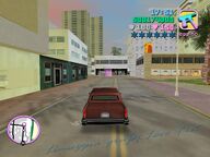 Tommy Vercetti driving the Love Fist limousine towards Rock City.