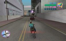 Tommy Vercetti shooting at the agent's car.