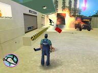 Two Spand Express vans, one exploding and another on fire.