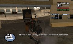 Carl uses a forklift to move boxes of ammunition while Ryder holds off the National Guard.