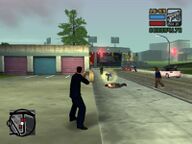 Toni Cipriani shooting at attacking Forelli Family mobsters.