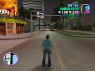 Tommy Vercetti waiting for the army, with their tank, to stop.