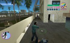 Tommy Vercetti shooting a security guard on his way up to the boss.