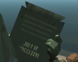 The statue's tablet, complete with the humorous inscription, GTA IV.